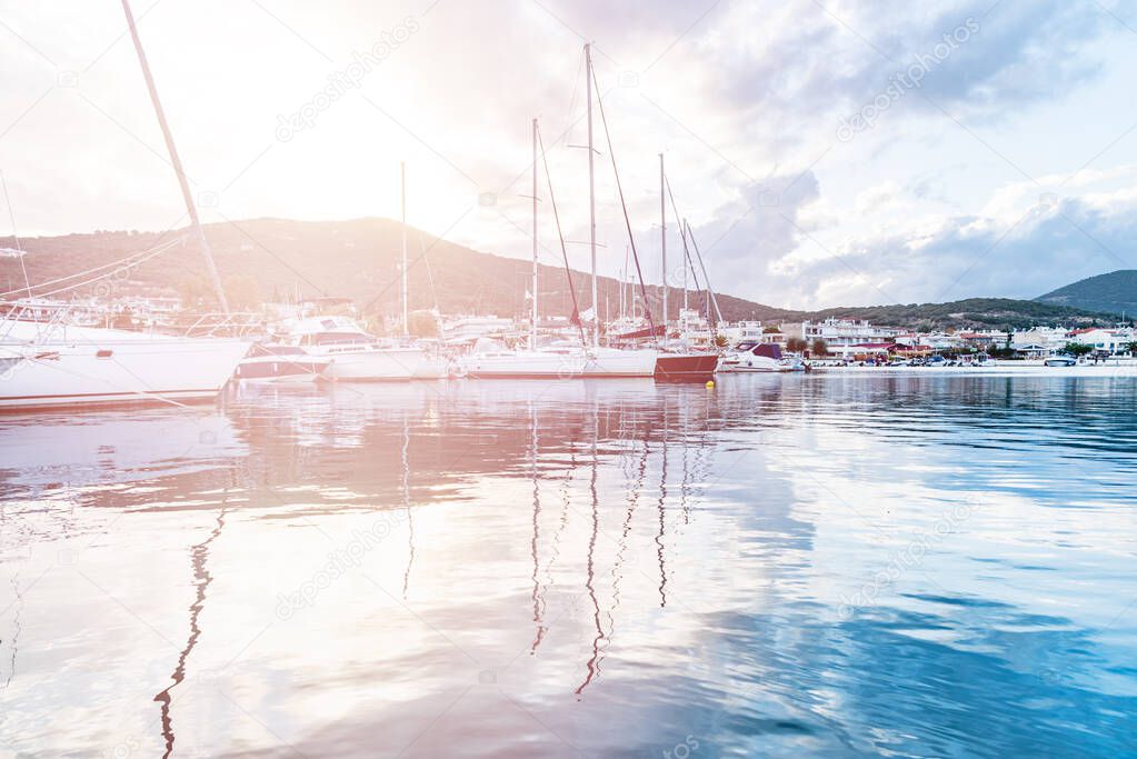 Pier with boats during sunset.