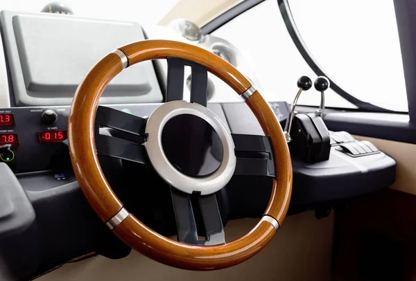 Steering wheel on motorboat used by boat captain when steering vessel from lower deck