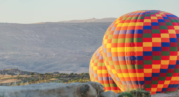 Close up shot of hot air balloon during flight in Cappadocia valleys.