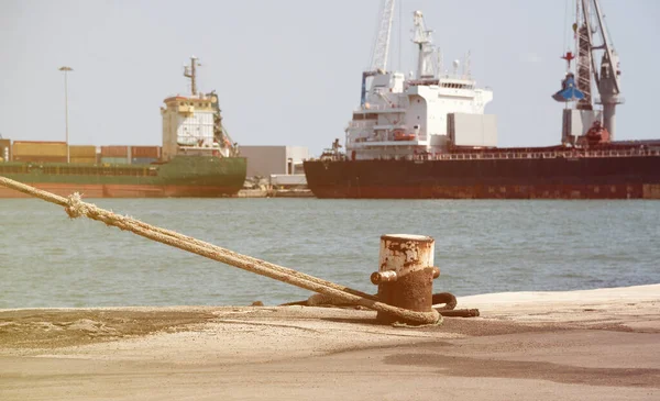 Looking from pier at big ships