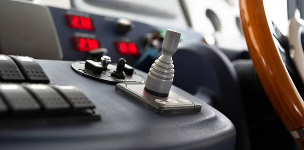 Instruments and gauges on dashboard used by a boat captain when steering the vessel from the lower deck on motor yacht