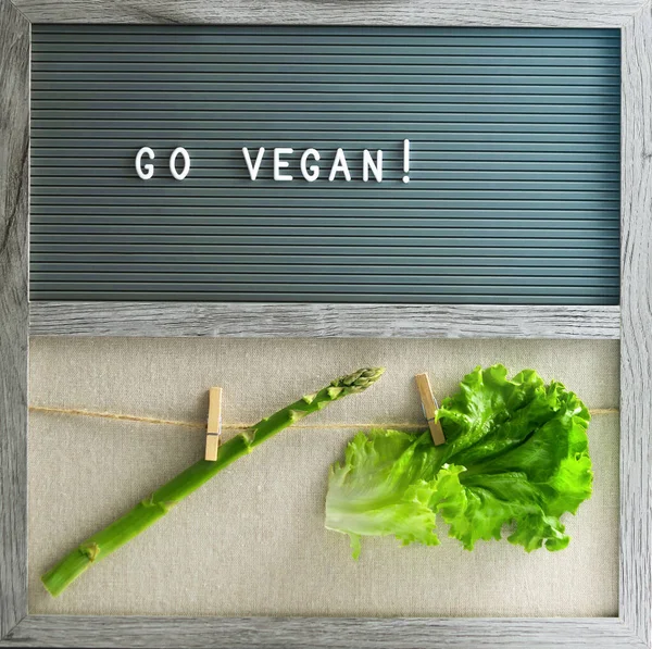 Still life with Go vegan text. Vegan concept.