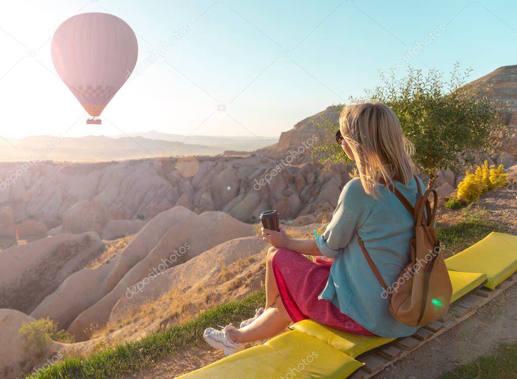 Blonde woman enjoying view in Cappadocia, Turkey. Travel concept.