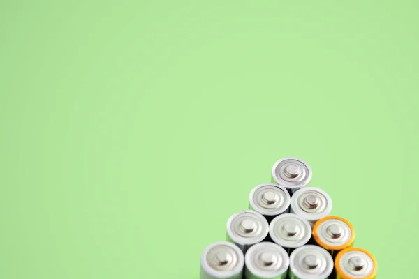 Group Batteries Green Background Copy Space — Stock Photo, Image
