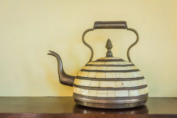 Arab antique teapot on a wood table — Stock Photo, Image