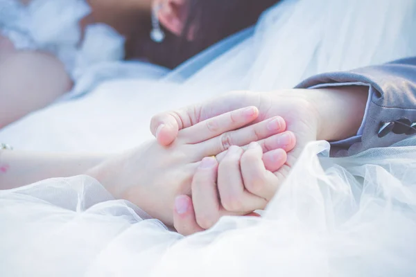 Wedding theme, holding hands newlyweds — Stock Photo, Image