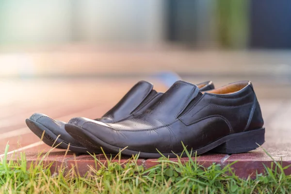Black leather shoes for men on wooden vintage,Accessory for men.