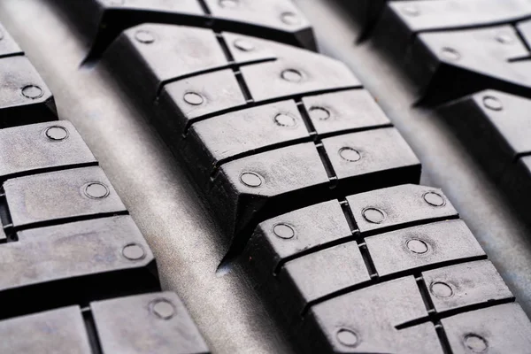 road tread protector all-season summer tire. close up. the tread blocks and sipes for evacuating water from the contact patch. grousers
