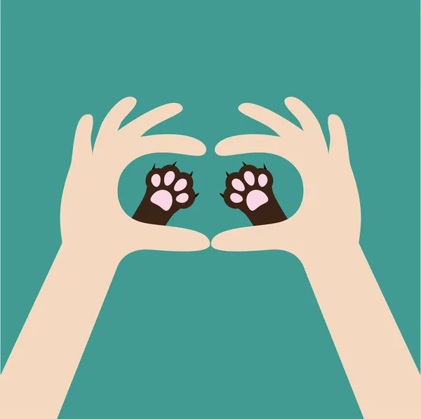 Mãos segurando patas de gato bonito — Vetor de Stock