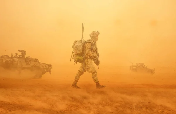 Military forces between storm & dust in the desert in battlefield