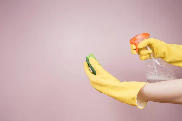 stock image gloved hands spray disinfectant on a sponge. the concept of disinfection and sanitation in the context of the pandemic and beyond