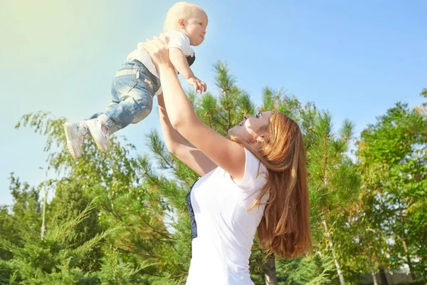 Happy beautiful mother and baby daughter or son — Stock Photo, Image