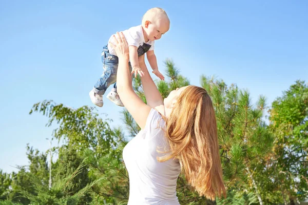 Happy beautiful mother and baby daughter or son — Stock Photo, Image