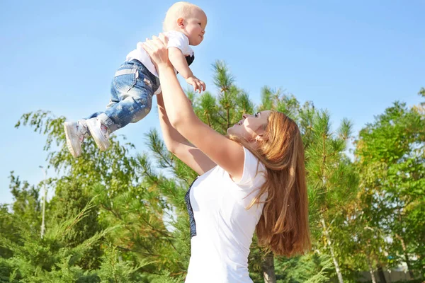 Happy beautiful mother and baby daughter or son — Stock Photo, Image