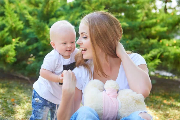 Happy beautiful mother and baby daughter or son — Stock Photo, Image