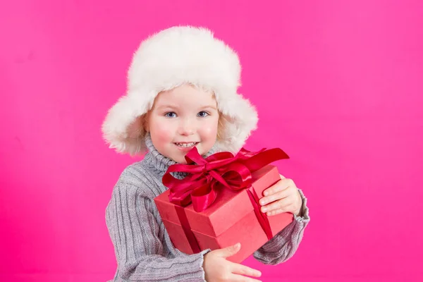 Beautiful little girl with a gift — Stock Photo, Image