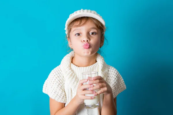 Beautiful little girl with glass of milk — Stock Photo, Image