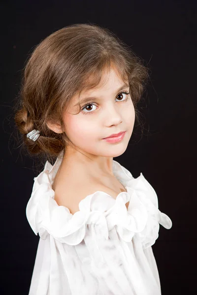 Beautiful Brunette little Girl wiht Long Hair. Stock Photo