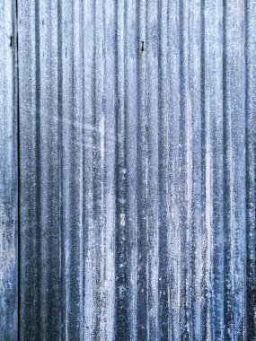Old blue worn metal surface with paint background. Classic blue color of the year 2020 concept.