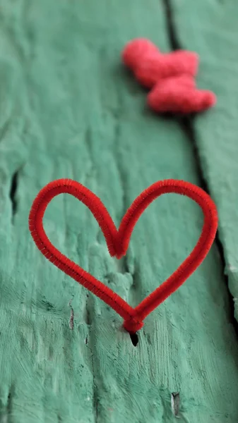 Valentine red heart on green background — Stock Photo, Image