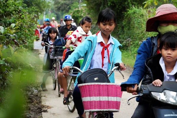 Asian little girl ride cycle from school — Stock Photo, Image