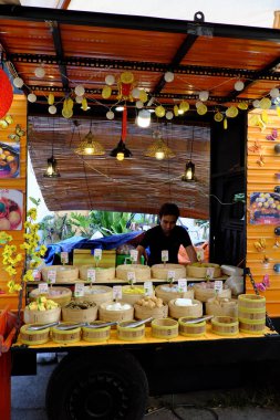 Outdoor restaurant with food court at weekend market, many snack