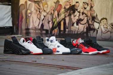 Nike Air Jordan series basketball shoes collection in different colors and models shot outdoors on wooden flooring. A set of sneakers by famous brand. Krasnoyarsk, Russia - February 7, 2015 clipart
