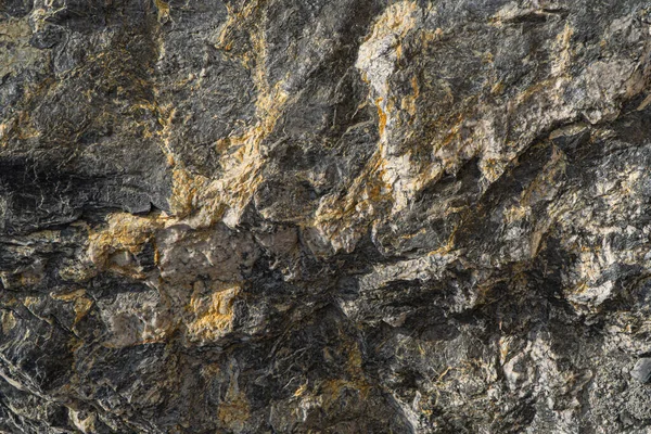 Oro textura mineral antimonio primer plano. Fondo de superficie de piedra mineral . — Foto de Stock