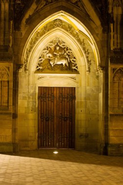 Ancient door at night of academy building Domplein