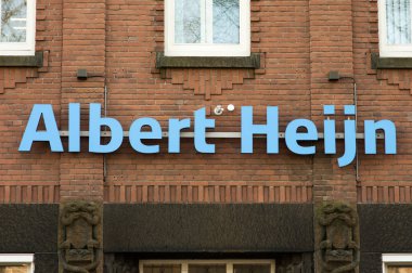 Arnhem, Netherlands - January 21, 2020: Logo of Albert Heijn on a facade. Albert Heijn is the largest and most famous dutch supermarket chain