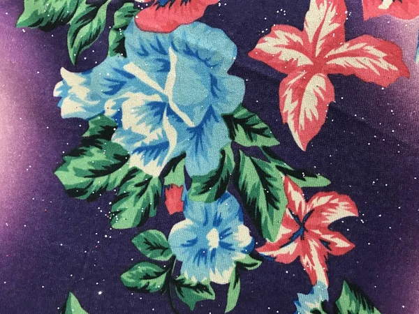 Beautiful colorful flowers on batik background