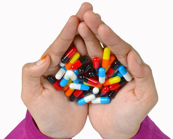 Top view of the pills on the hand and white background, A hand hold the pills and drug, Pile of the drug and pills on the hand. — Stock Photo, Image