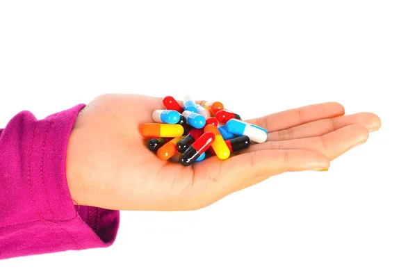Top view of the pills on the hand and white background, A hand hold the pills and drug, Pile of the drug and pills on the hand. — Stock Photo, Image