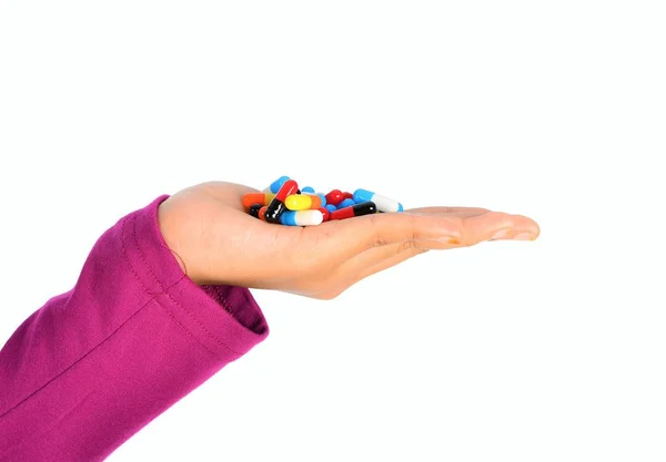 Top view of the pills on the hand and white background, A hand hold the pills and drug, Pile of the drug and pills on the hand. — Stock Photo, Image