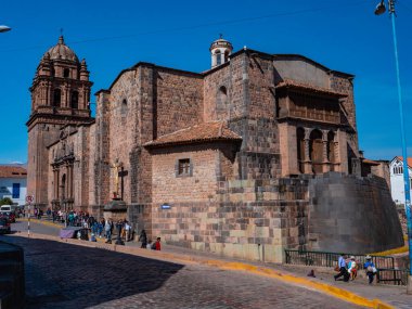Side view of colonial church of Koricancha (Coricancha or Temple of the Sun) is built on top of an ancient Inca temple. Ancient Inca constructions. Cusco city, Peru  clipart