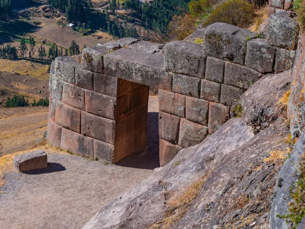 Pisac ruins. The old entrance door to the ancient citadel. Walls, doors and citadel made with perfect rock lace.