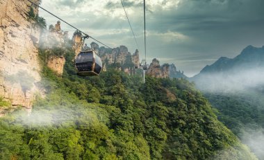Cable car connecting Wulingyuan with Tianzi Mountain, Zhangjiajie National Park, China clipart
