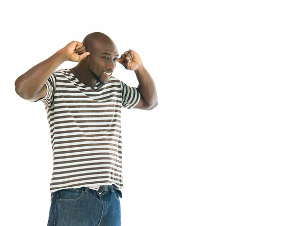 Afro-americano homem entupindo ouvidos — Fotografia de Stock