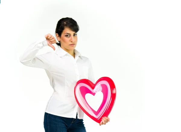 Woman with heart showing thumbs down — Stock Photo, Image