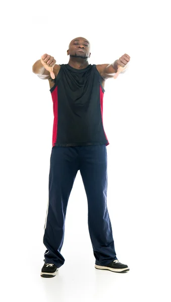Atleta en forma hombre mostrando pulgares hacia abajo —  Fotos de Stock