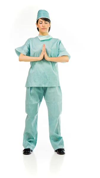 Kobieta lekarz modląc się — Zdjęcie stockowe