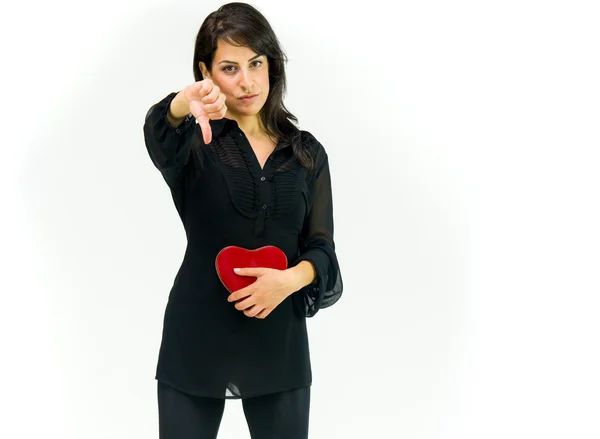 Woman with heart showing thumbs down — Stock Photo, Image