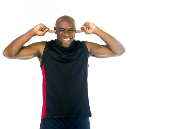 Afrikansk Amerikan atlet pluggning öron — Stockfoto