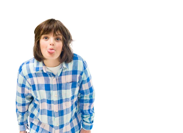 Teenage boy showing tongue — Stock Photo, Image