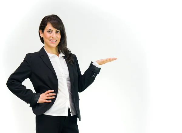 Businesswoman presenting something on hand — Stock Photo, Image