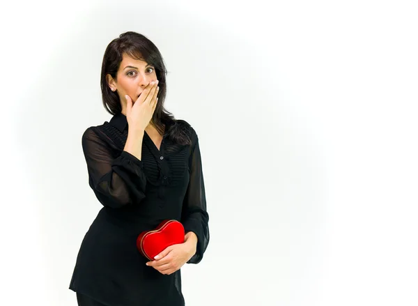 Shocked surprised woman with heart — Stock Photo, Image