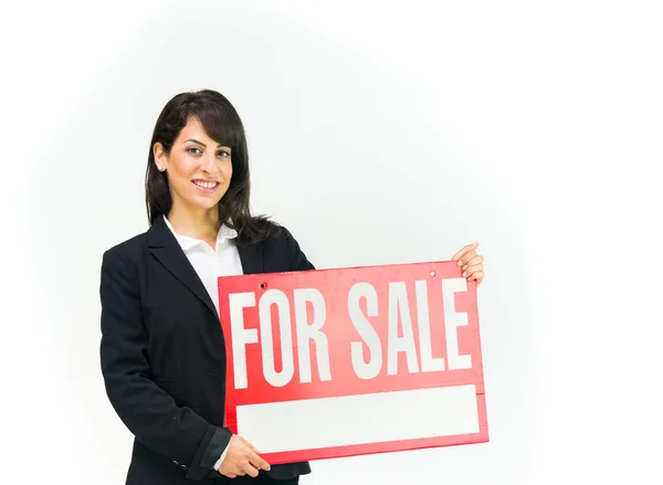 Businesswoman holding for sale banner — Stock Photo, Image
