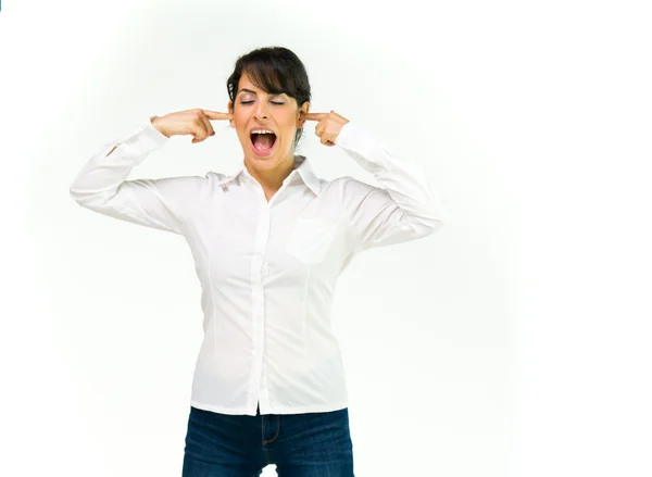 Angry woman plugging ears — Stock Photo, Image