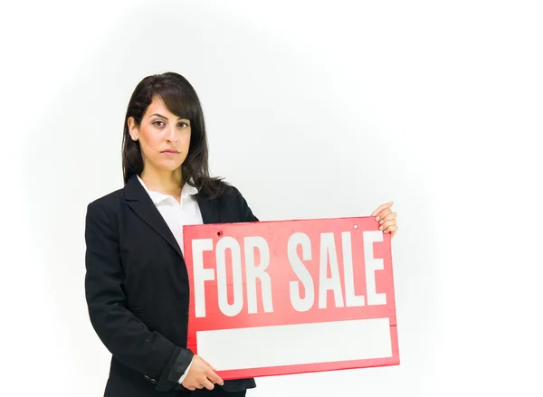Mujer de negocios sosteniendo para la venta banner — Foto de Stock