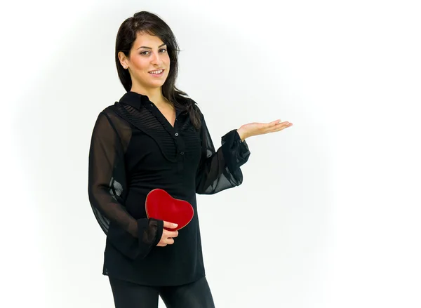 Woman with heart presenting on hand — Stock Photo, Image